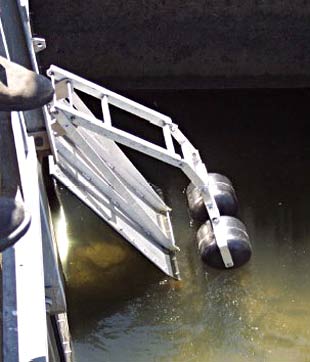 Figure 2. Automatic tidal floodgates consist of a mini-floodgate within a normal flapgate. The floating arm closes the mini-floodgate when the tide rises (Photo Frederieke Kroon) Figure 2. Automatic tidal floodgates consist of a mini-floodgate within a normal flapgate. The floating arm closes the mini-floodgate when the tide rises (Photo Frederieke Kroon)